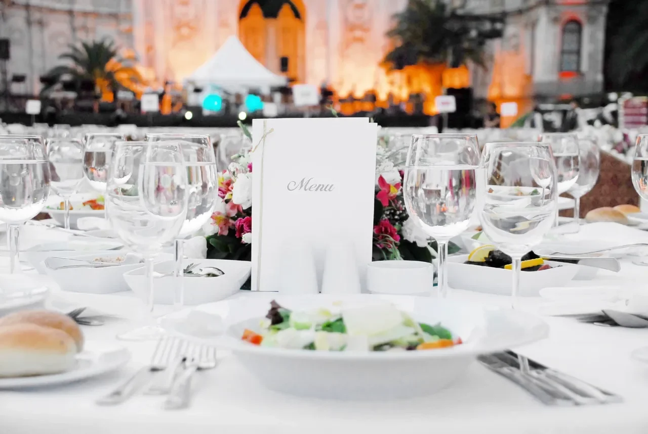 Elegant dining setup with a gourmet salad and menu card