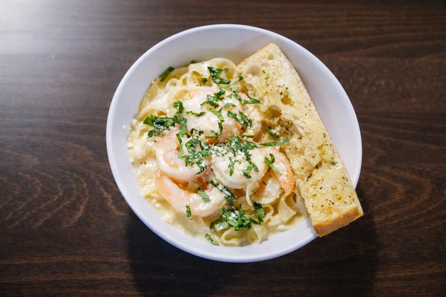 Shrimp Alfredo with scratch-made sauce and garlic focaccia at Maddalena's Italian Cafe