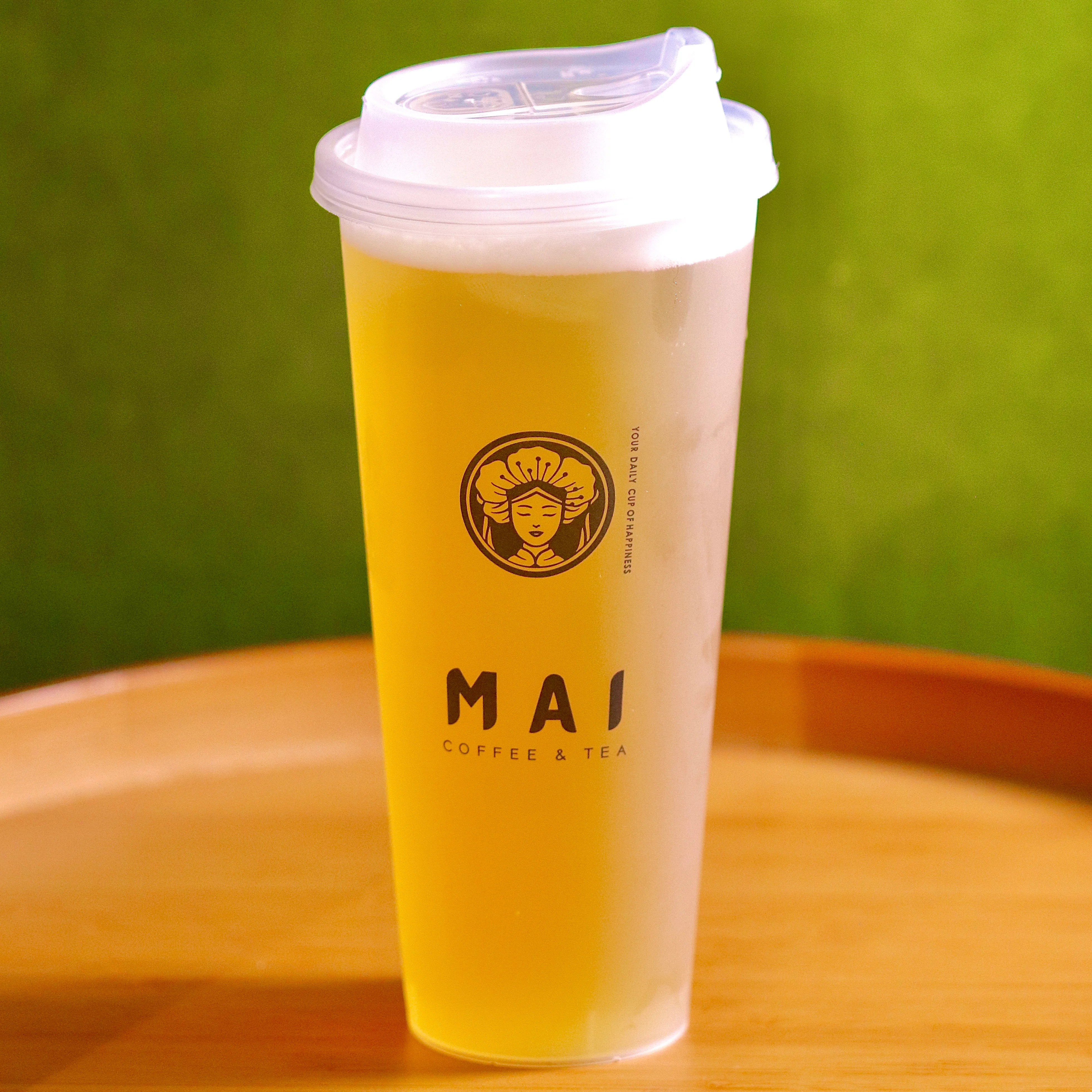 Refreshing iced tea in a branded cup from a coffee shop