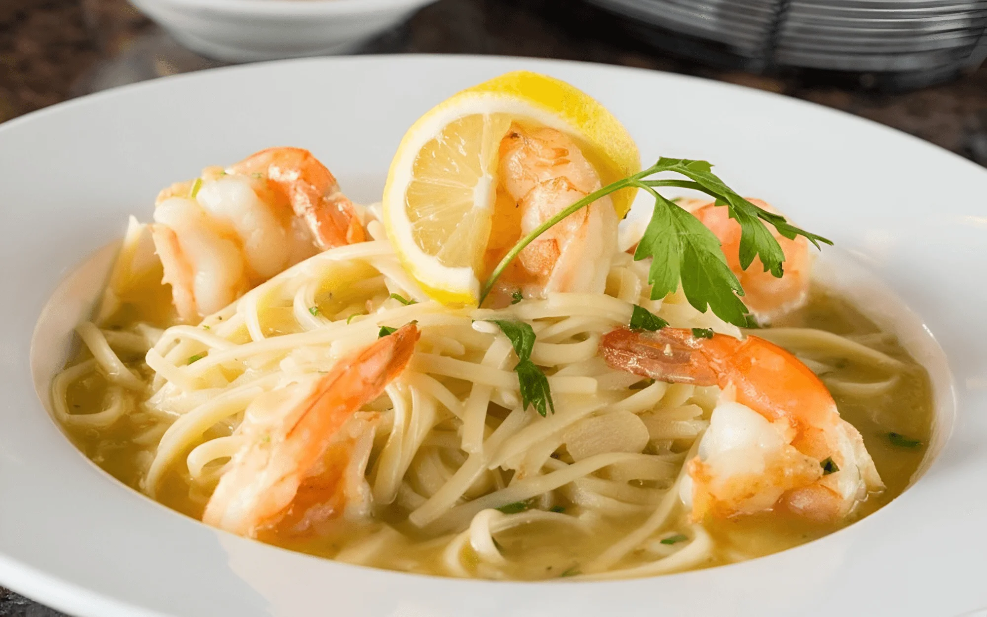 Pasta served with shrimp, lemon, and a light garlic butter sauce.