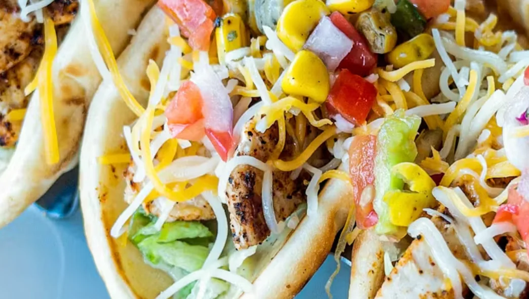 Grilled chicken tacos with fresh toppings