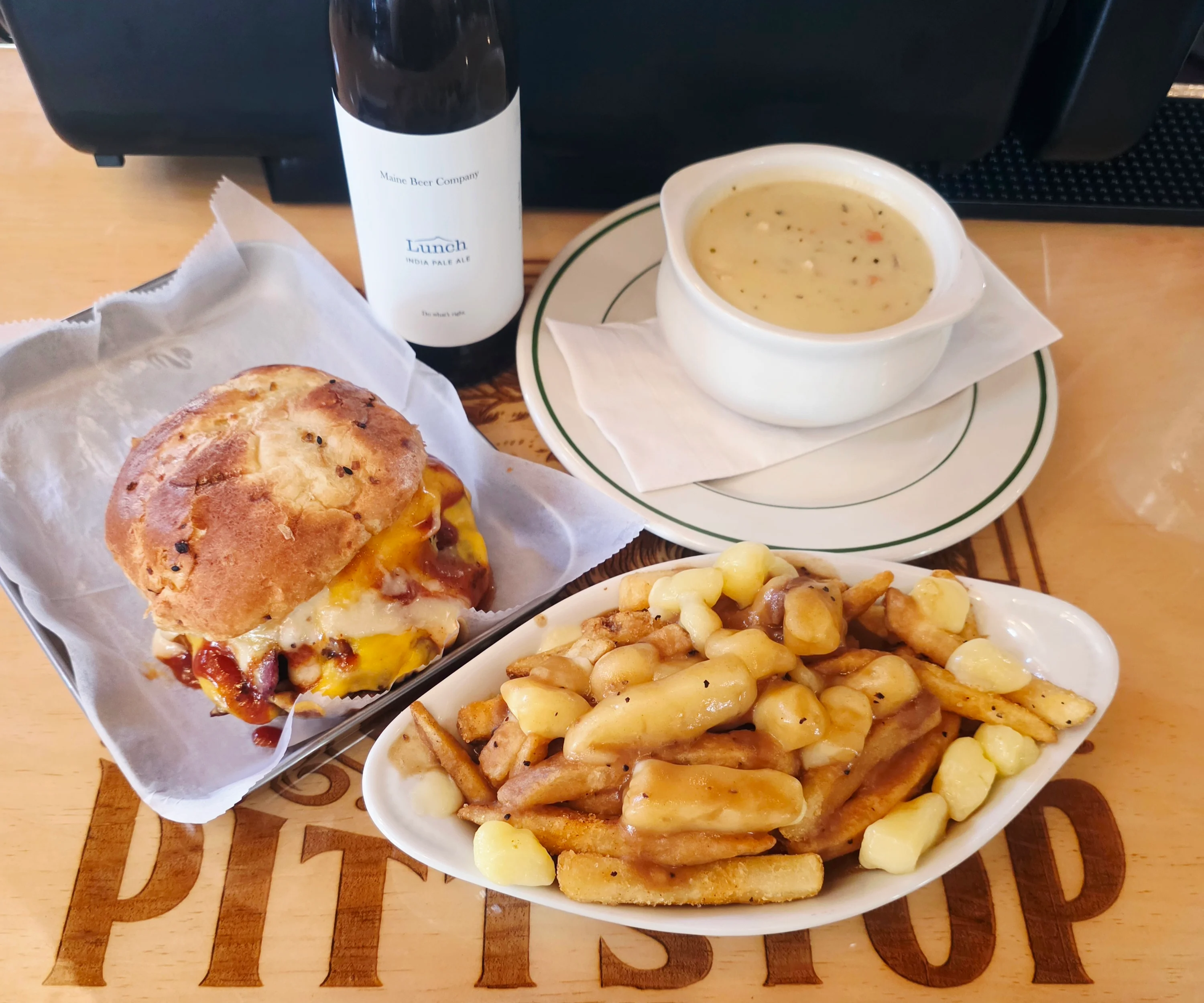 Delicious gourmet burger with fresh toppings on a wooden table