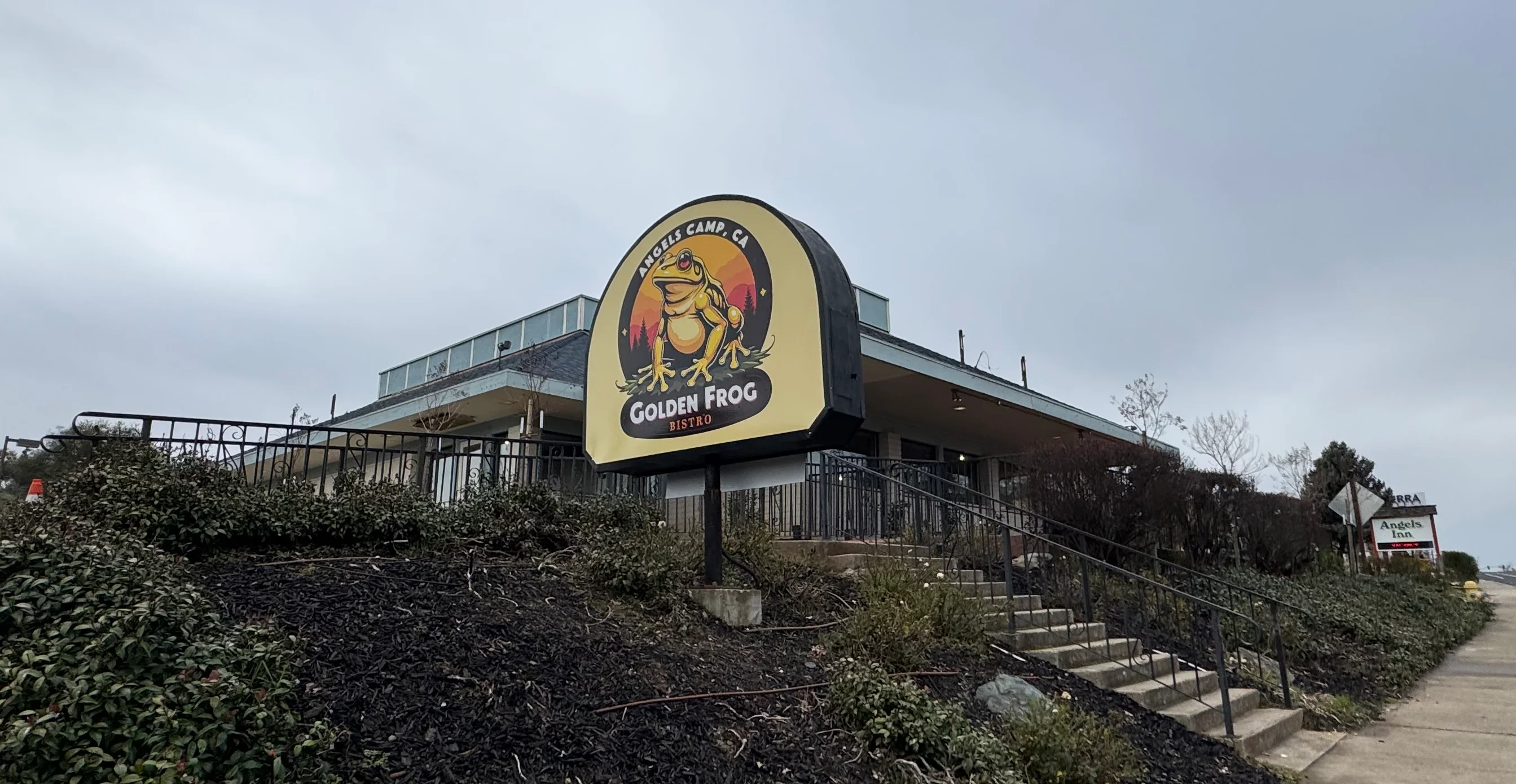 Exterior view of Golden Frog Bistro restaurant on a cloudy day
