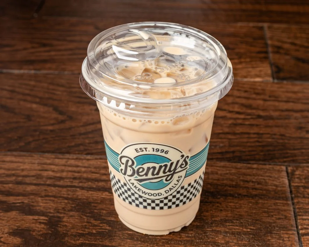 Iced coffee beverage in a clear cup from Benny's