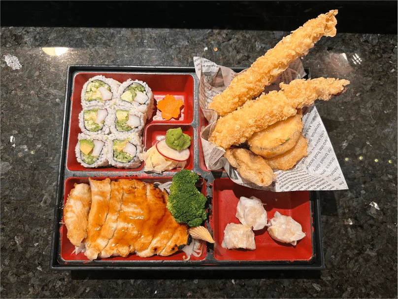 Bento box with tempura, California roll, salmon teriyaki and shumai from Mahzu East Windsor