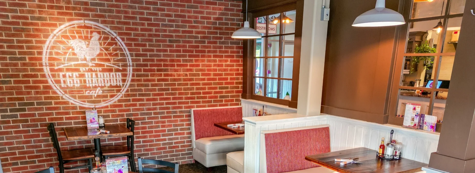 Cozy restaurant interior with brick walls and warm lighting