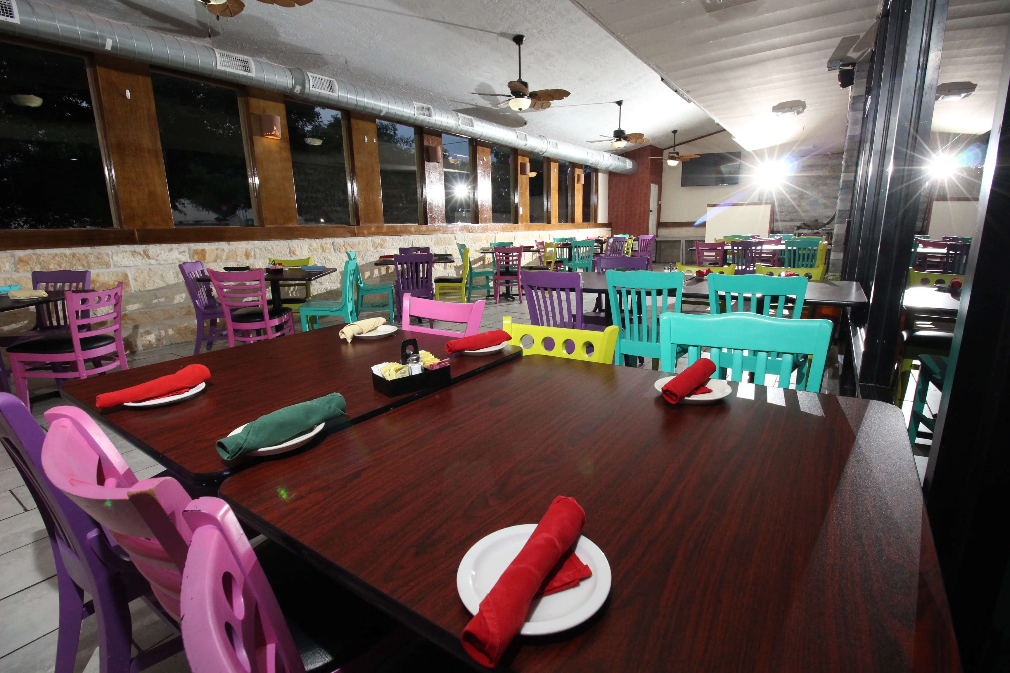 Colorful restaurant interior with vibrant chairs and tables