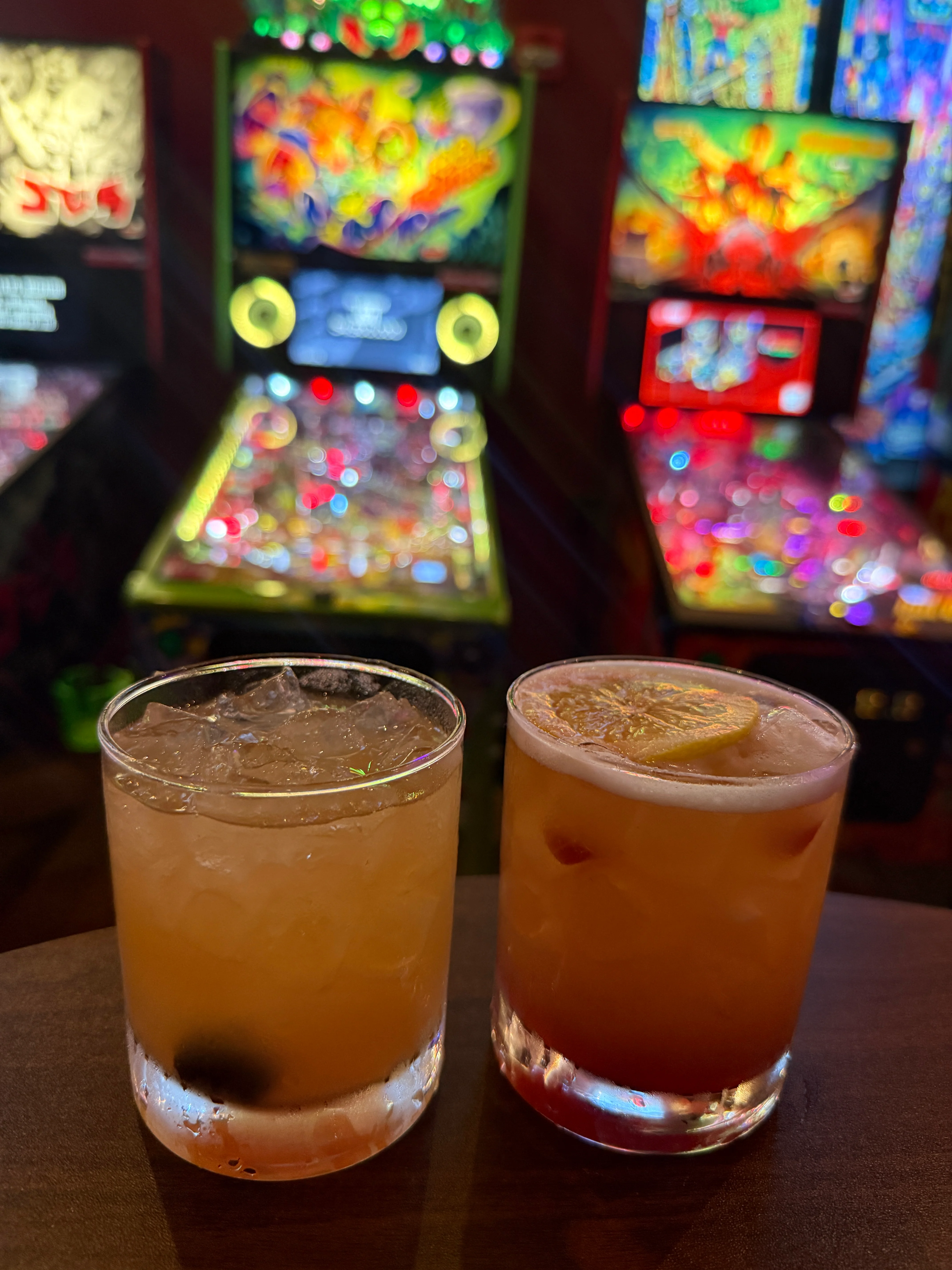 Colorful cocktails with ice and vibrant bokeh lights