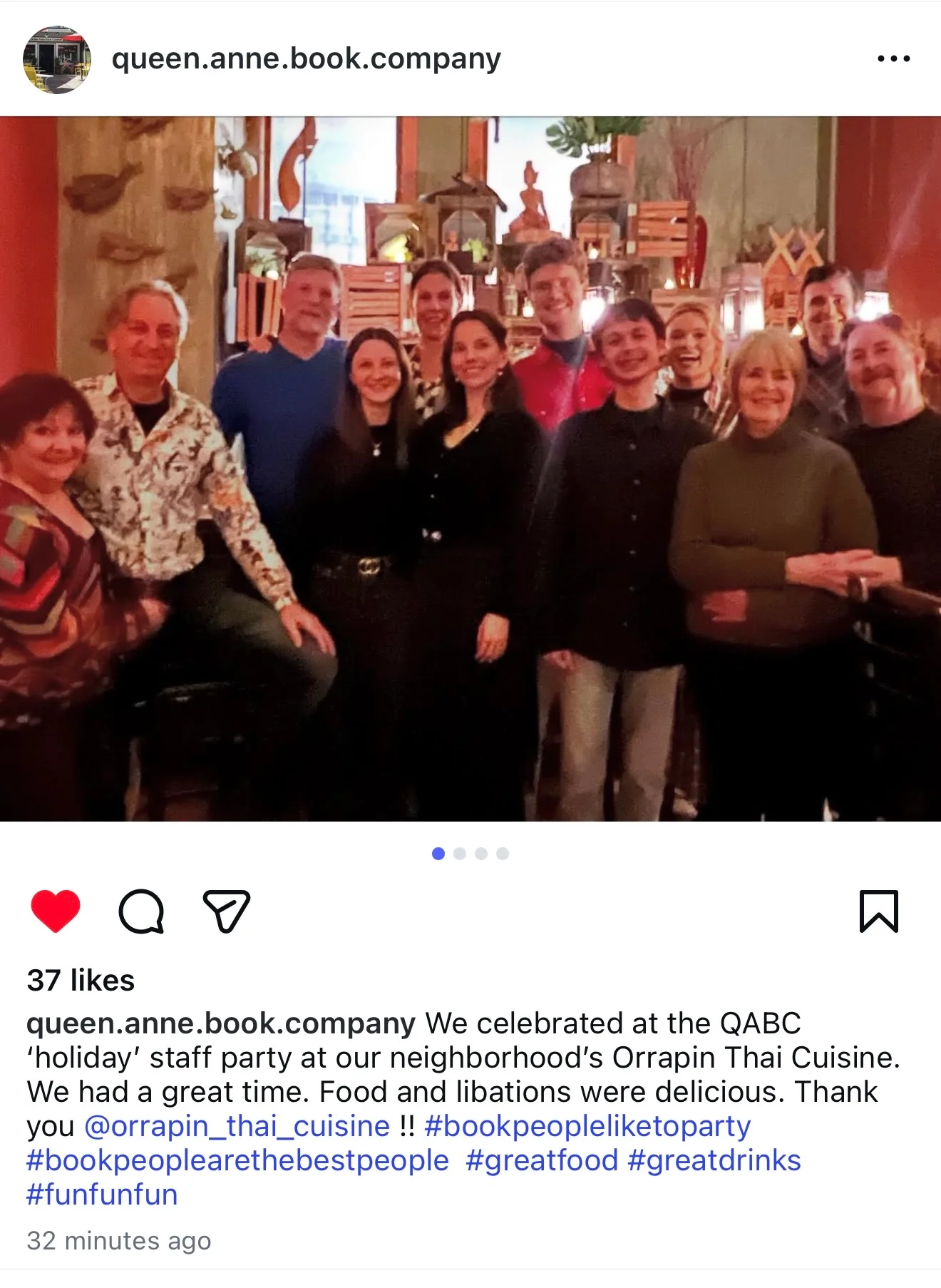 Group photo at a cozy Thai restaurant celebrating a staff party