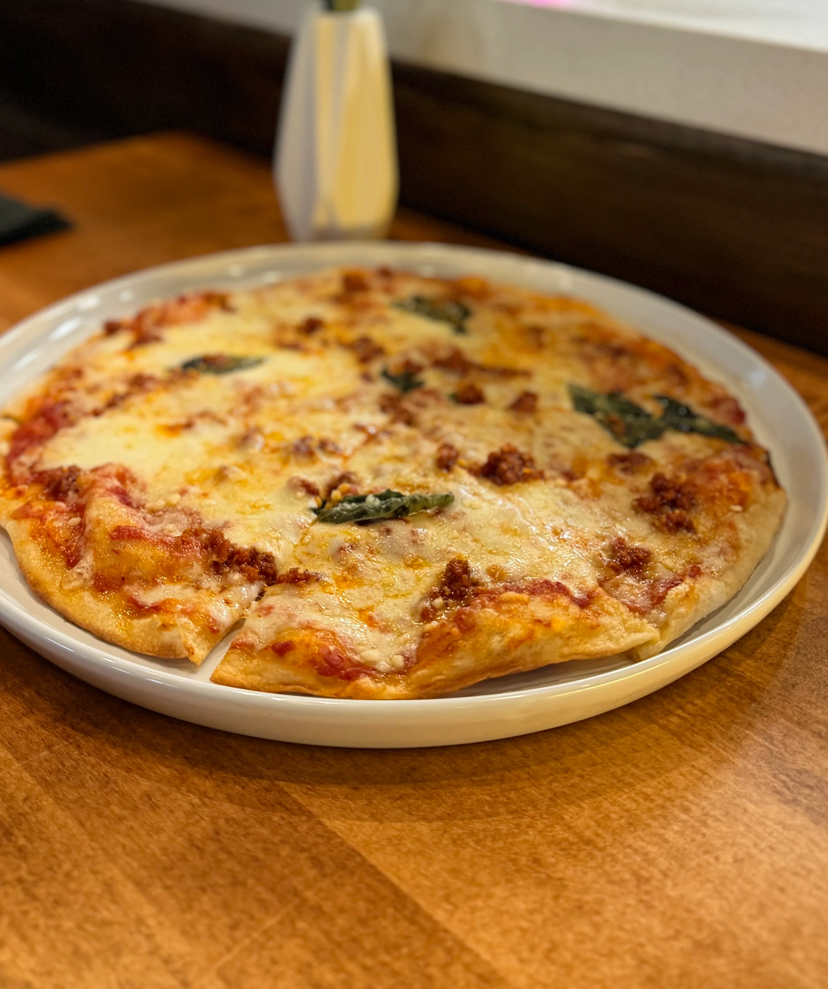 Delicious Margherita pizza served in a cozy restaurant setting