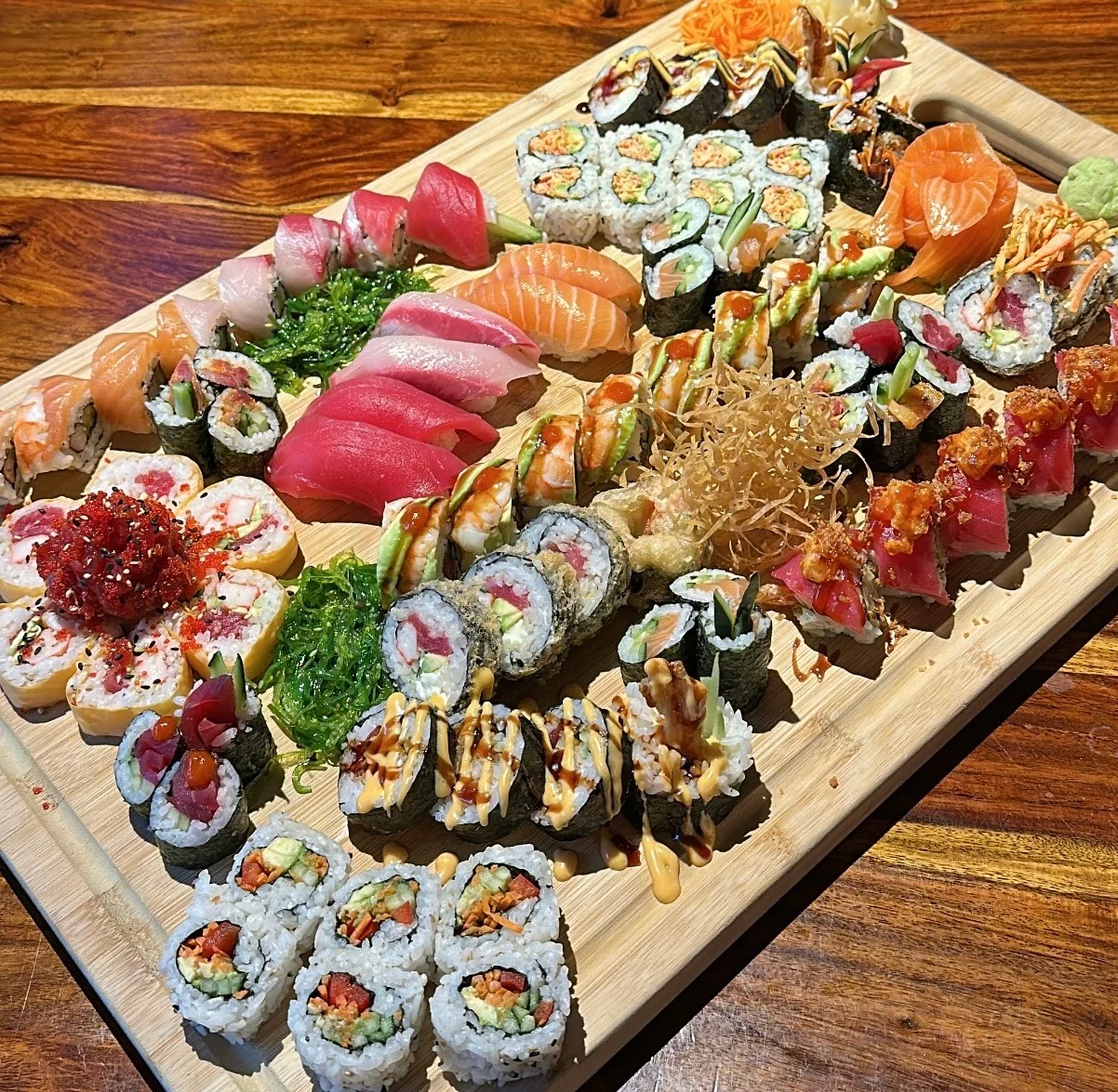 Japanese sushi and sashimi platter with assorted maki rolls