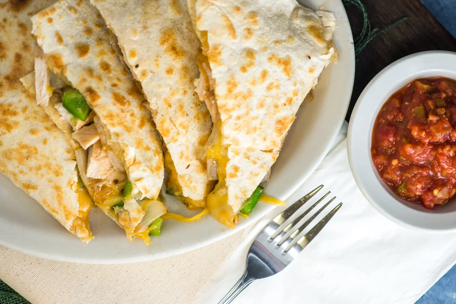 Grilled chicken quesadilla served with salsa