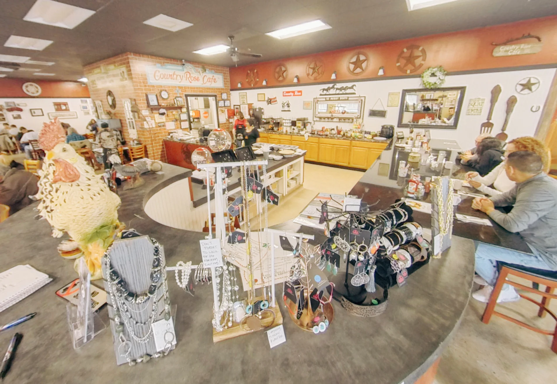Cozy cafe interior with jewelry displays and rustic decor