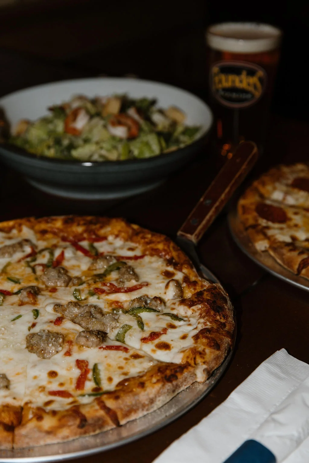 Delicious sausage pizza served with a fresh garden salad