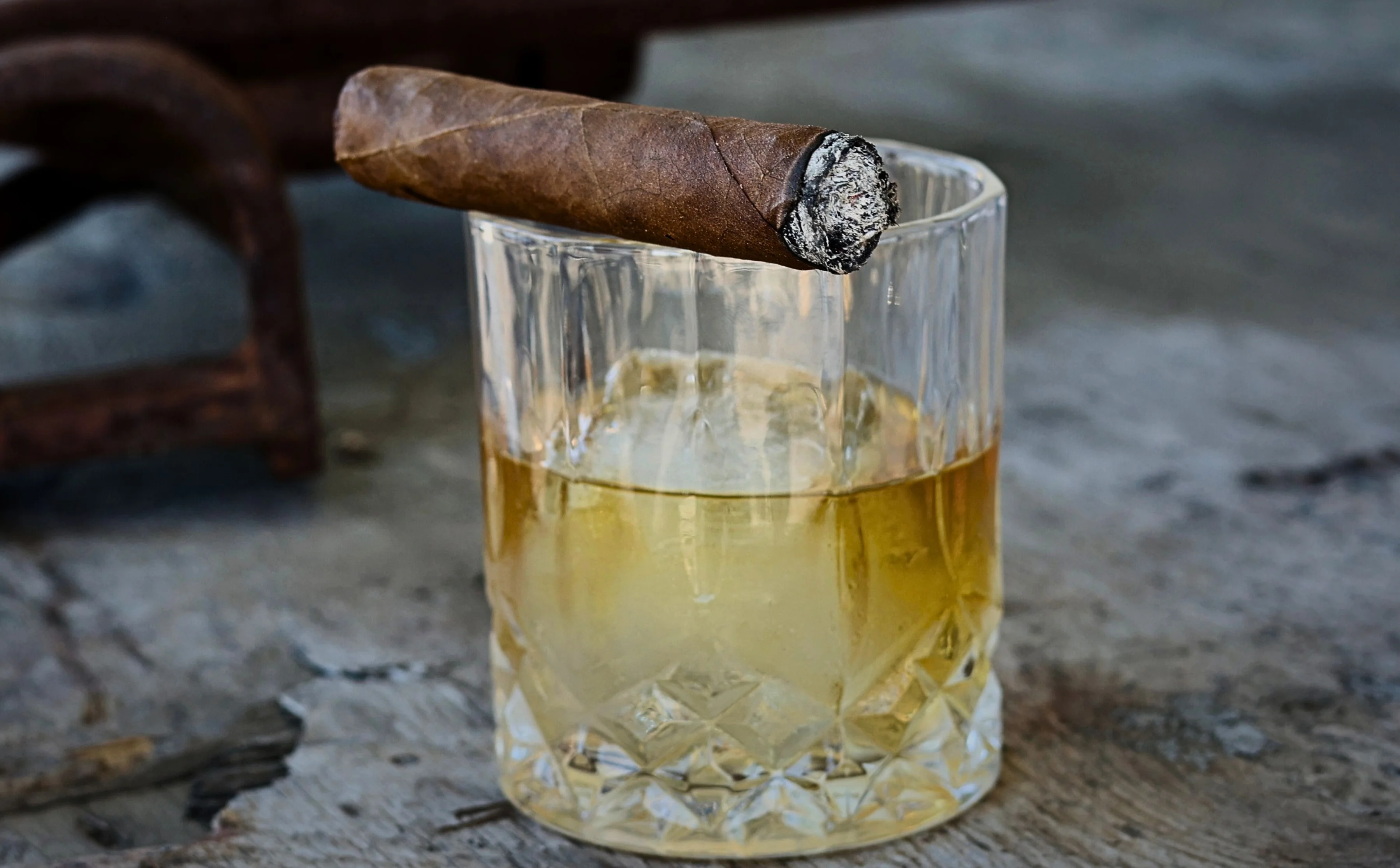 A selection of premium cigars displayed elegantly on a wooden surface.