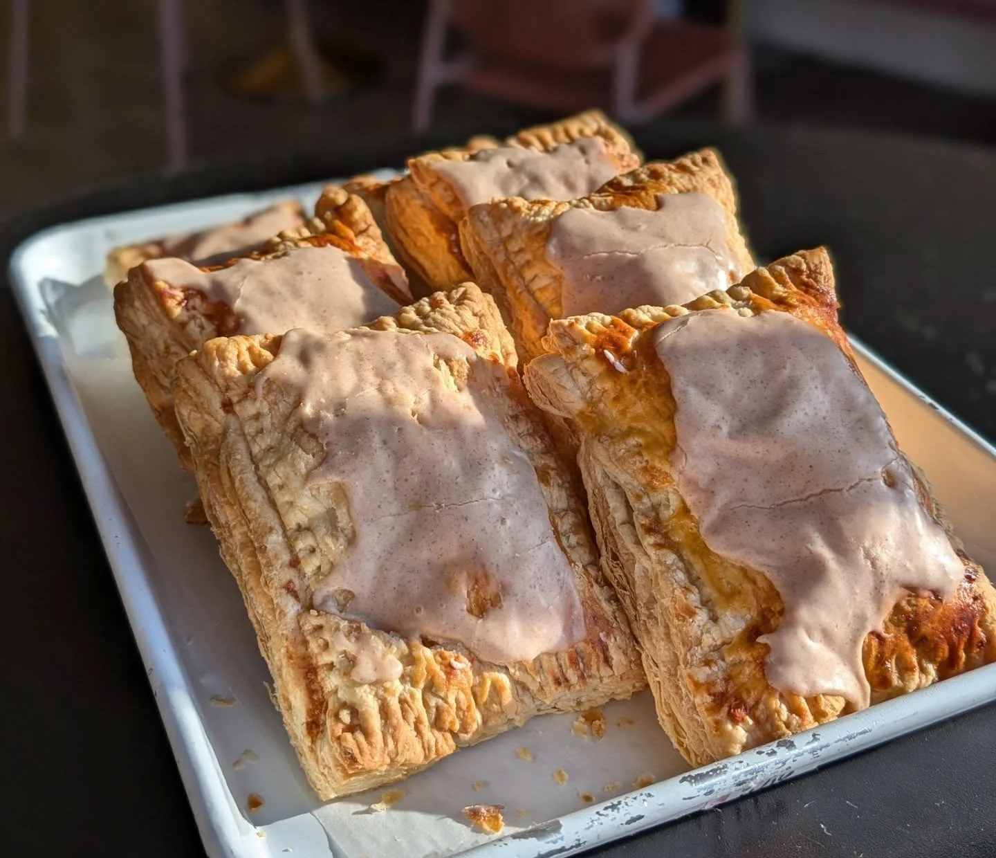 Freshly baked cinnamon pop tarts on a serving tray