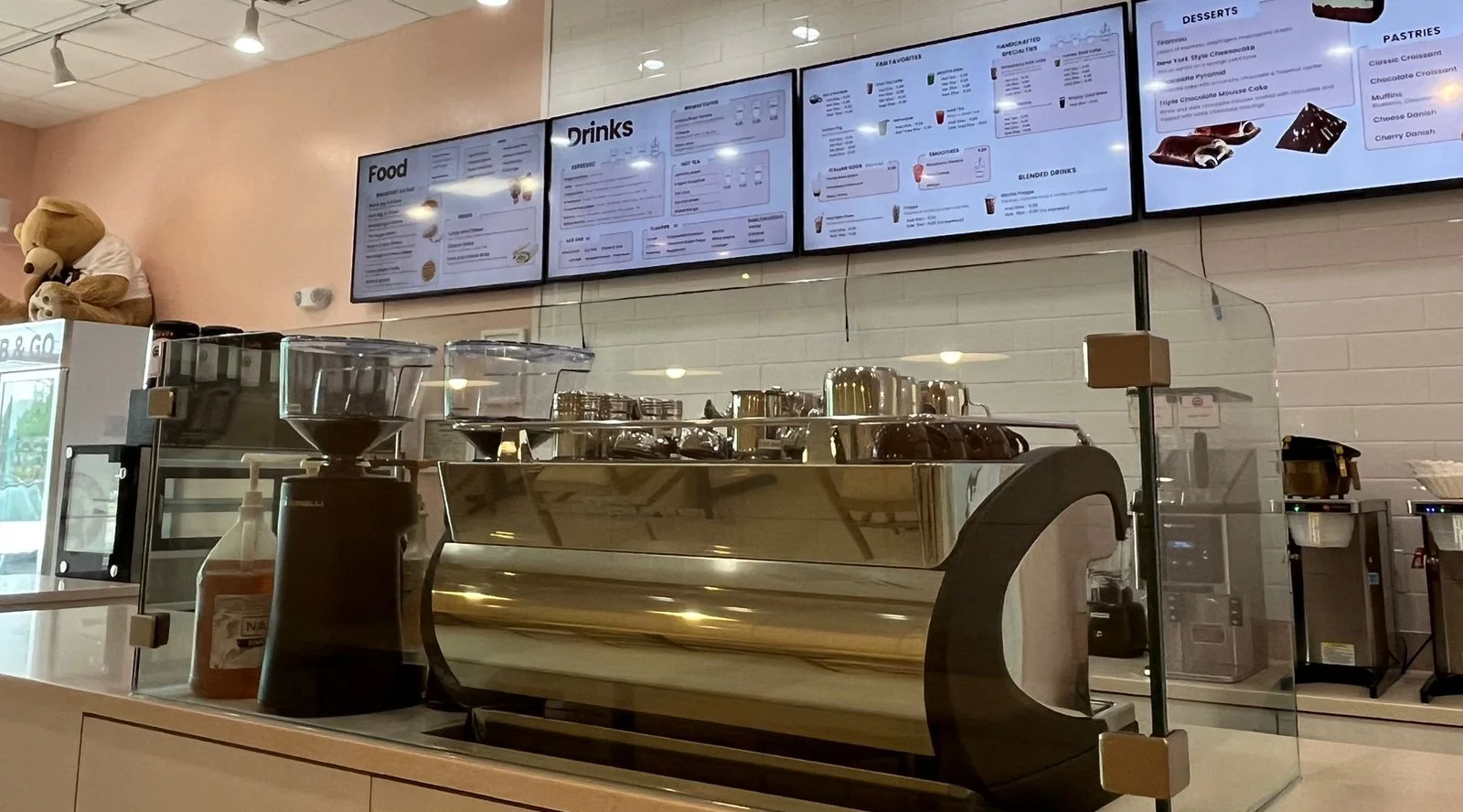 Cozy café interior with menu displays and coffee equipment