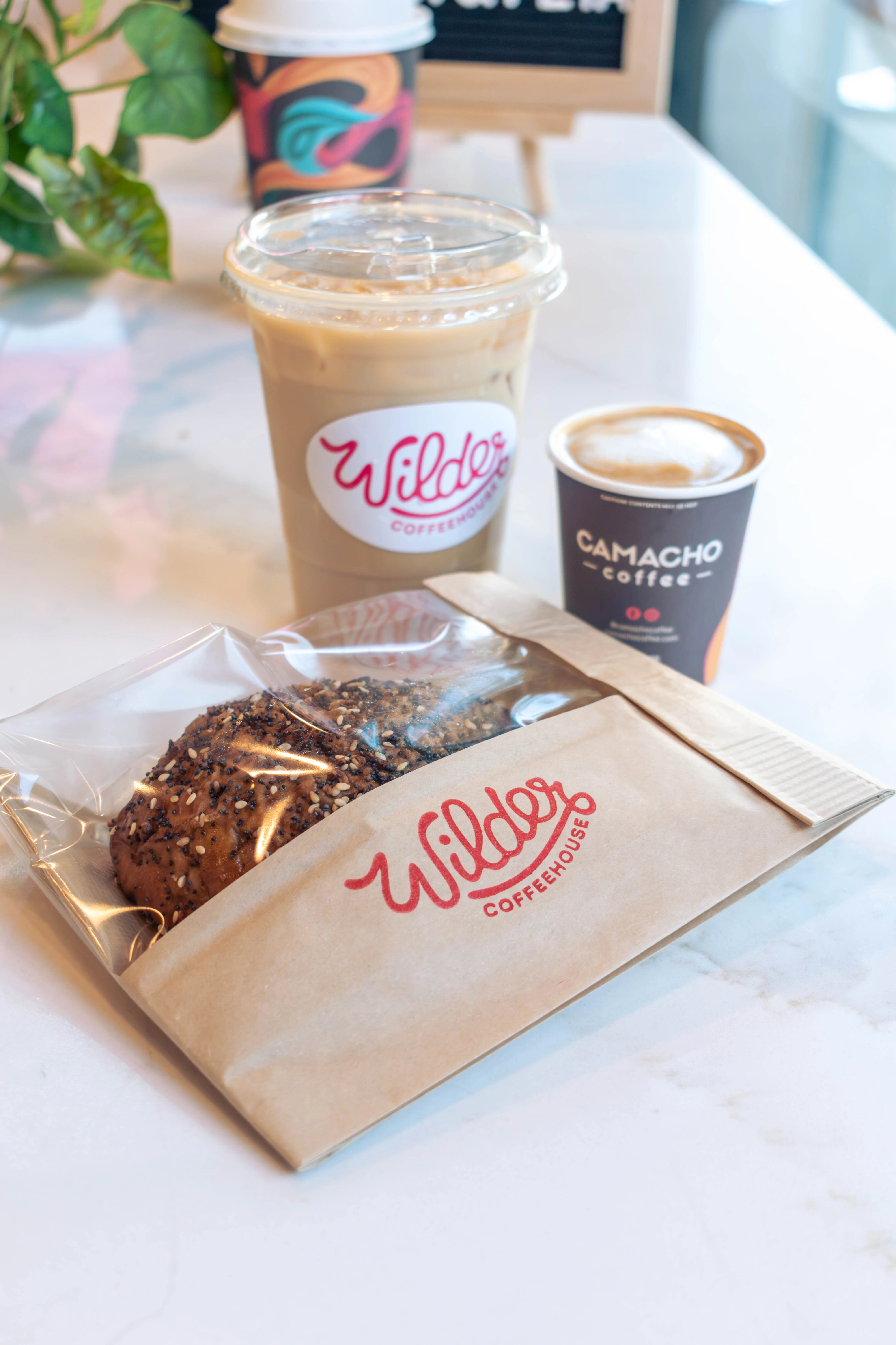 Bagel in a to-go bag on the counter