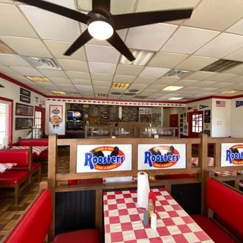 Cozy restaurant interior with red booths and checkered tablecloths