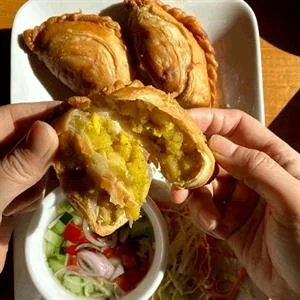 Delicious gourmet burger with fresh toppings on a wooden table
