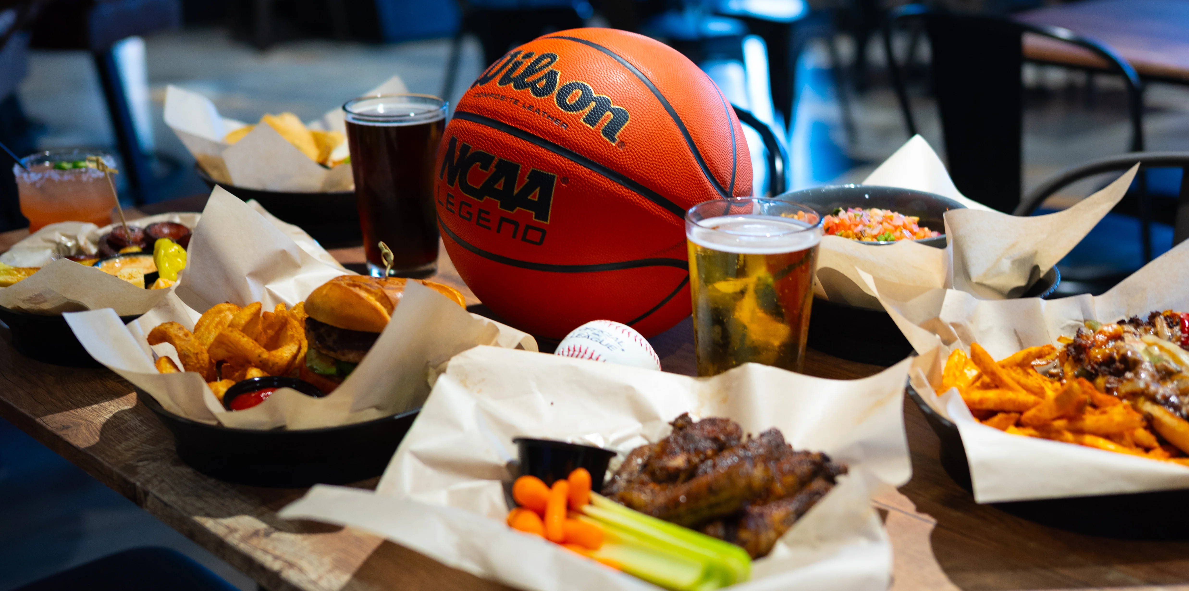 Casual dining with burgers, wings, and drinks in a sports bar setting