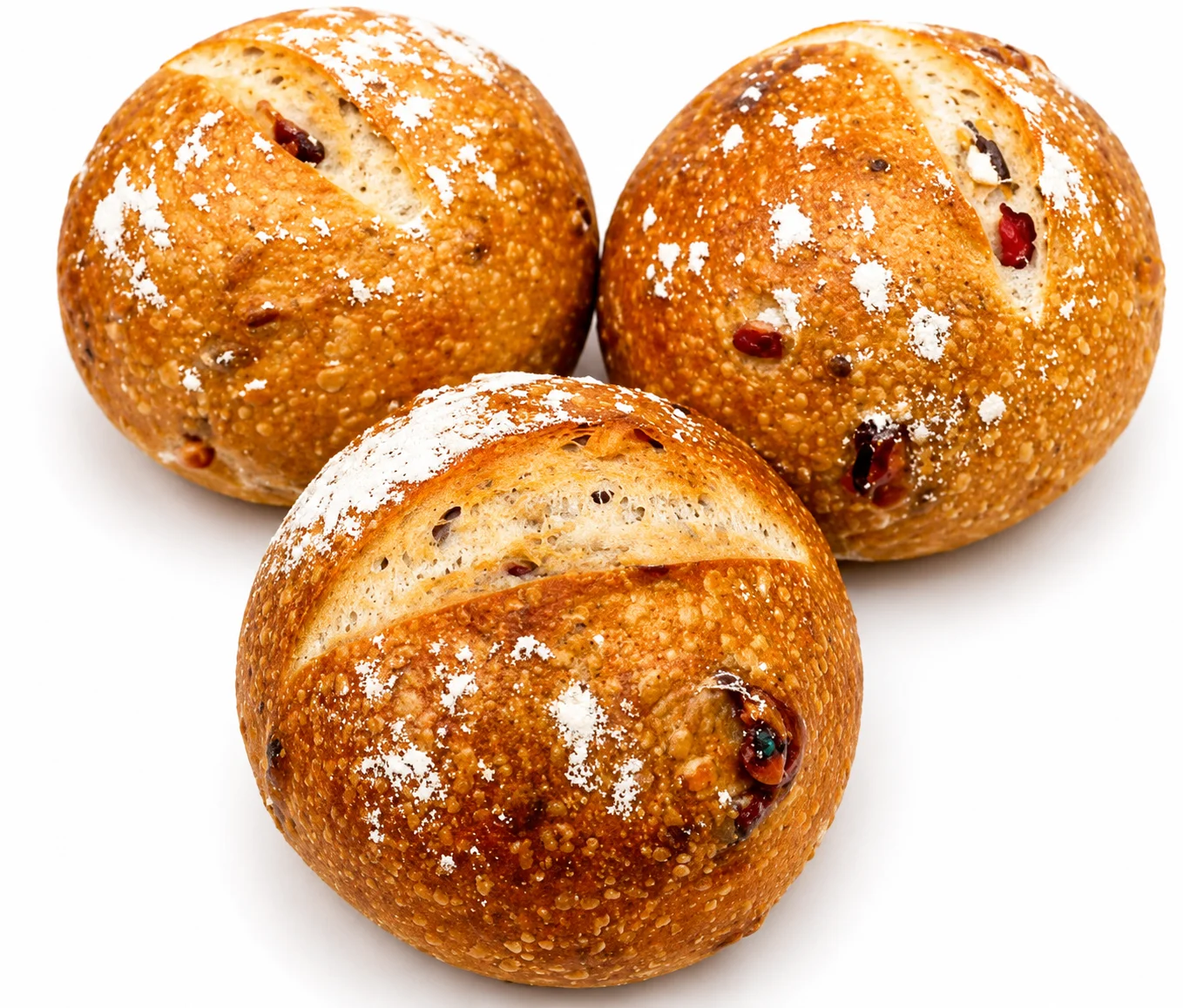 Three round artisan bread rolls dusted with flour.