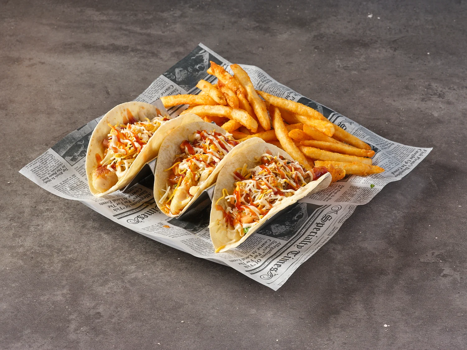 Fish tacos served with crispy fries
