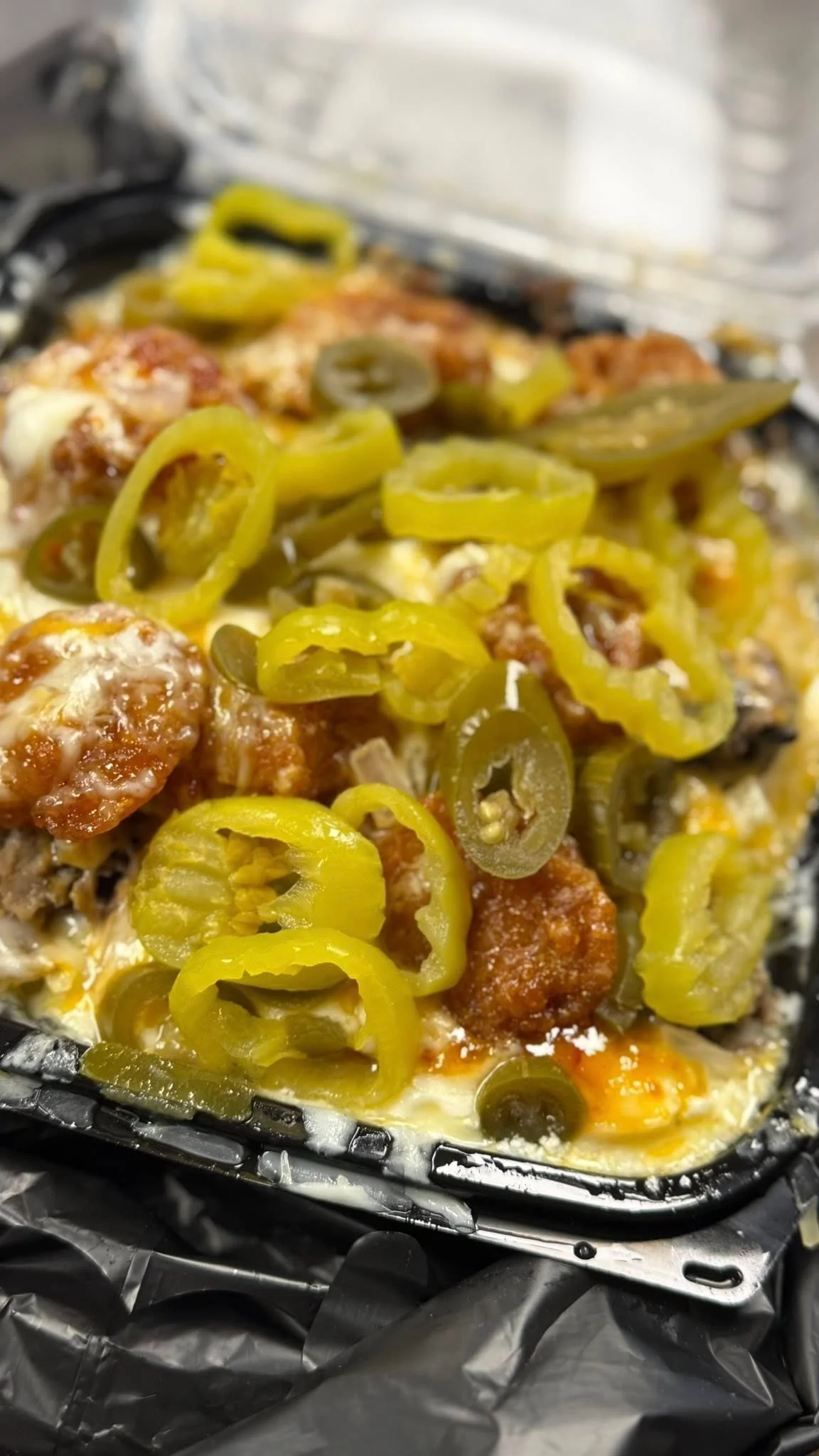 Loaded nachos topped with jalapeños and cheese