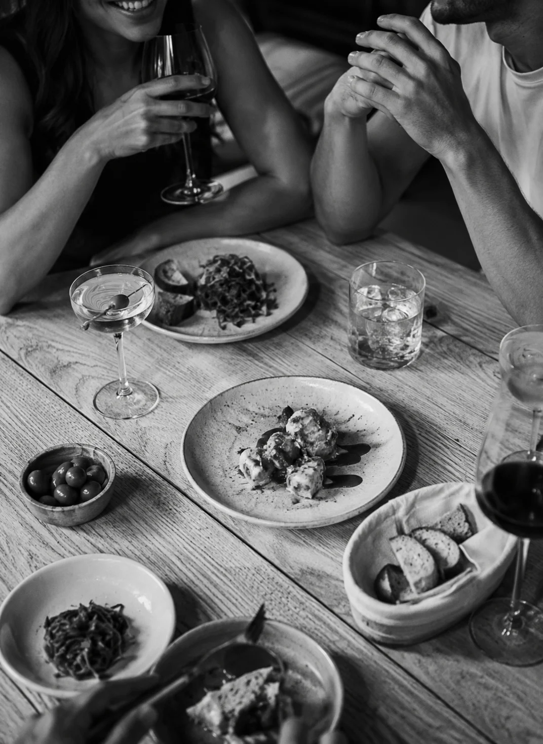 Elegant dining table with Italian antipasti and cocktails