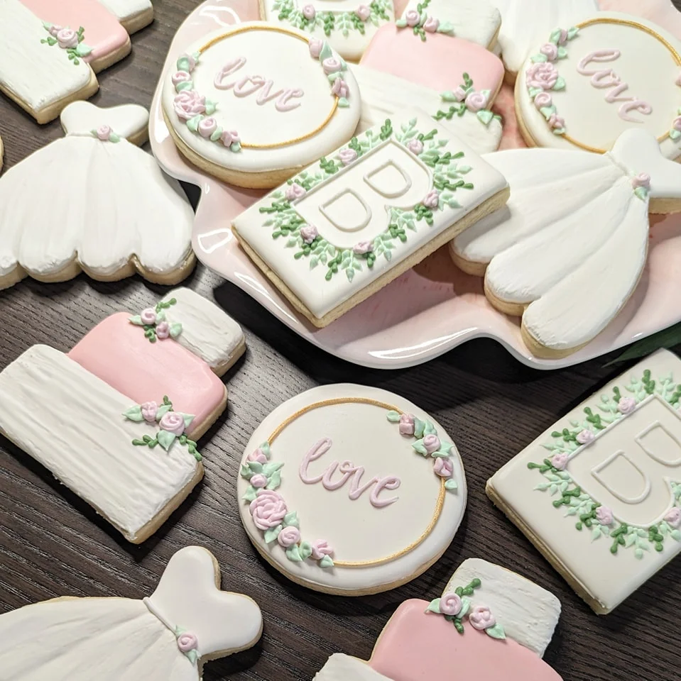 Decorative wedding cookies with floral designs and love theme