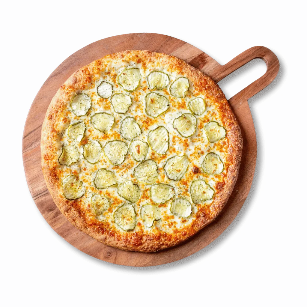 Pickle pizza on a wooden serving board
