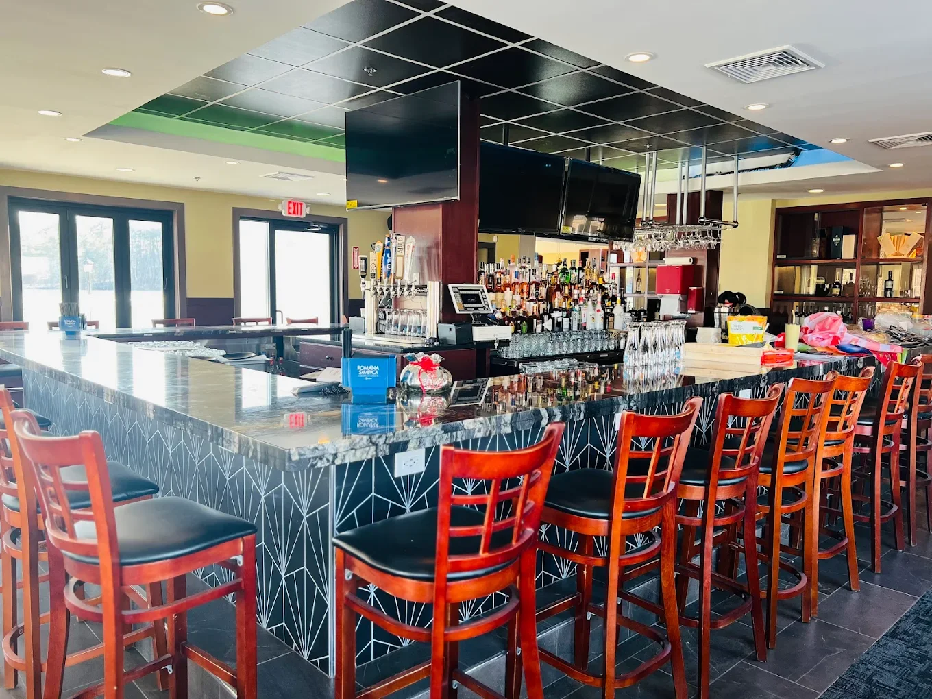Modern bar interior with stylish seating and a well-stocked counter
