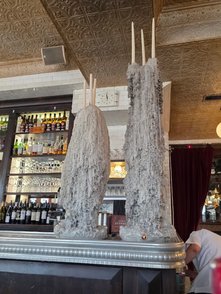 Unique decorative sculptures with candles in a stylish restaurant interior
