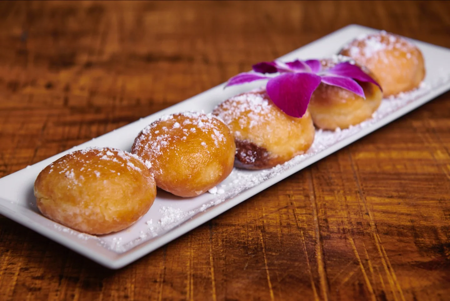 Nutella filled beignets dusted with powdered sugar