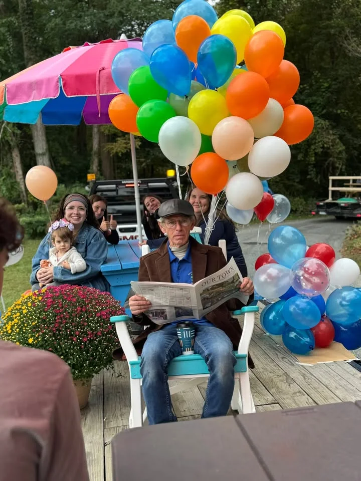 Celebration with balloons and family gathering outdoors