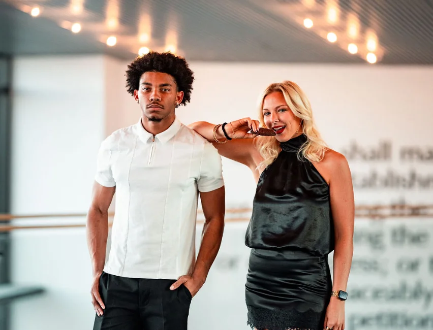 Stylish couple posing in modern restaurant setting