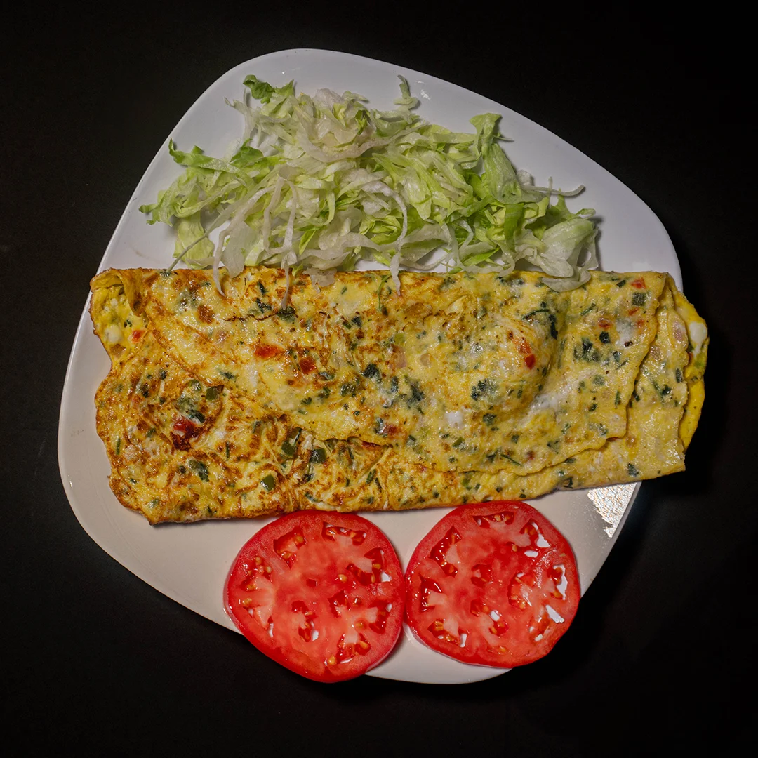 Delicious Mexican omelette with fresh salad and tomatoes