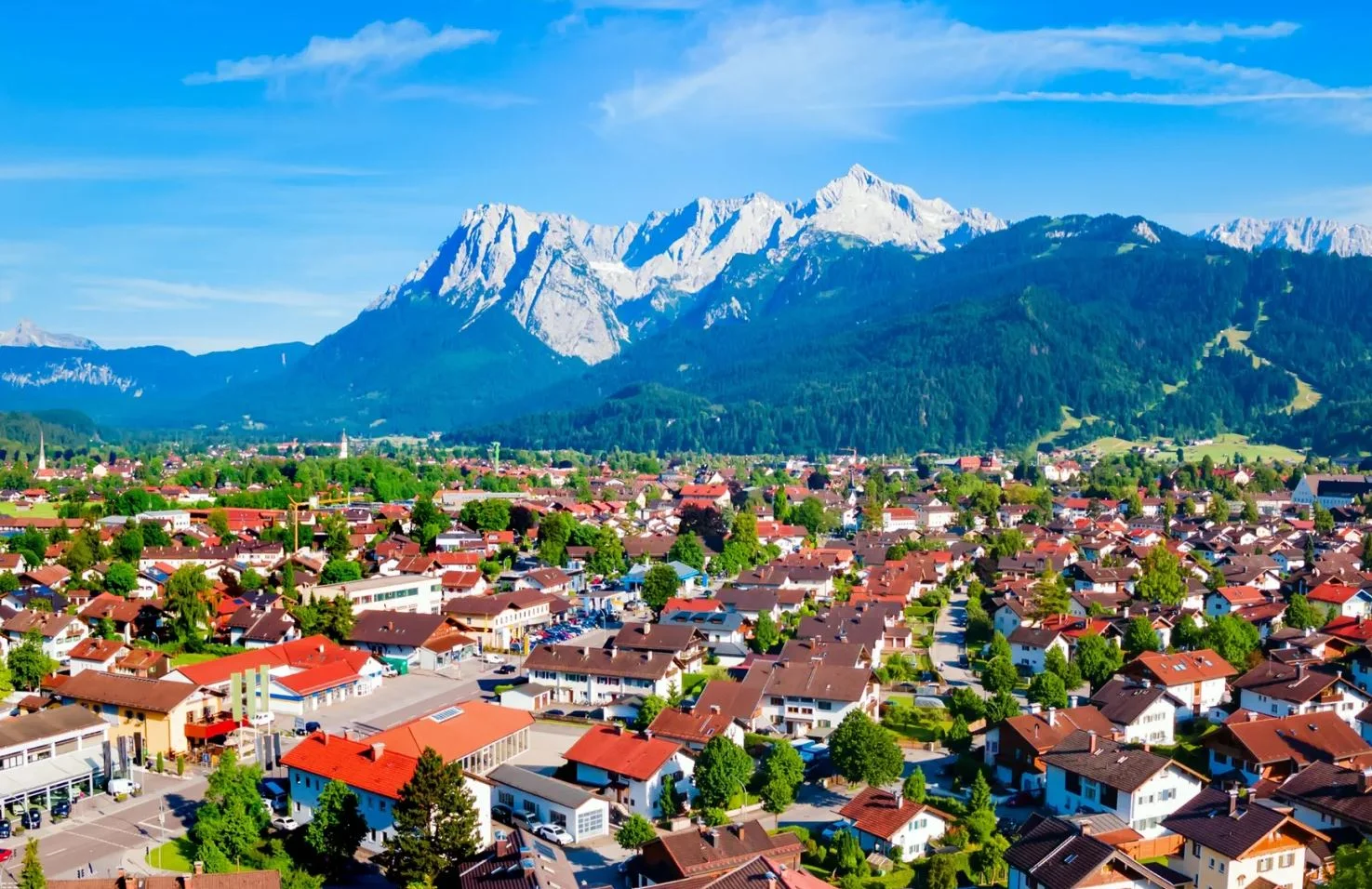 Scenic view of a picturesque village with mountains in the background