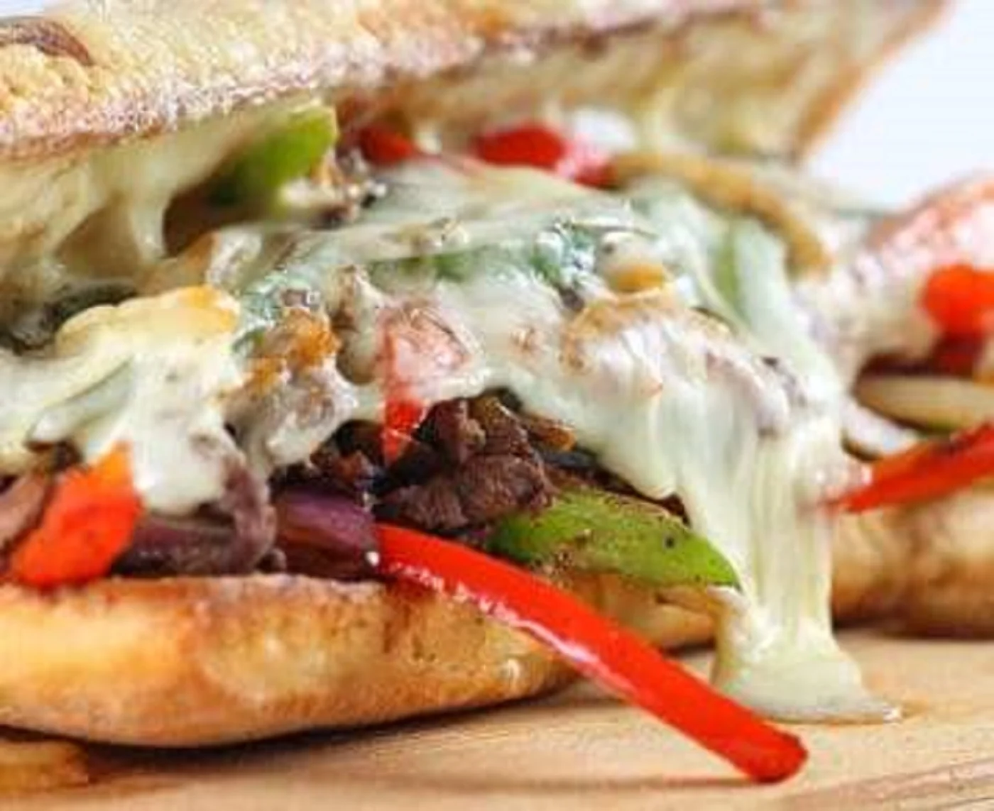 Melted cheese steak sandwich with peppers