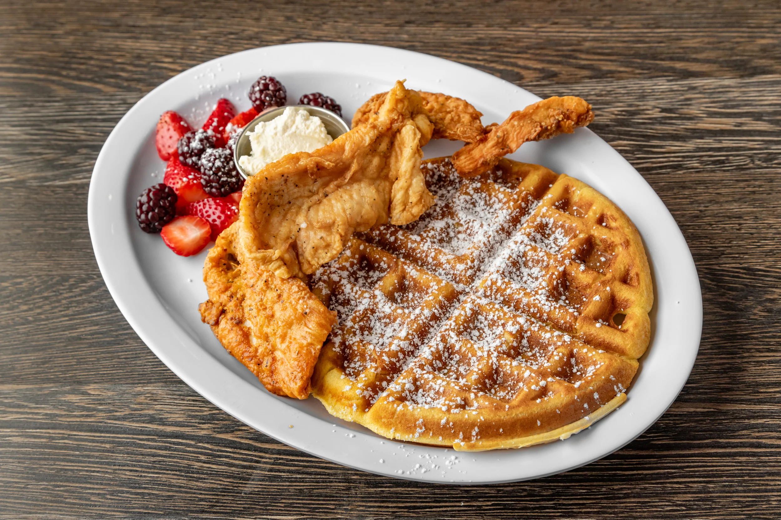 Southern chicken and waffles with fresh berries