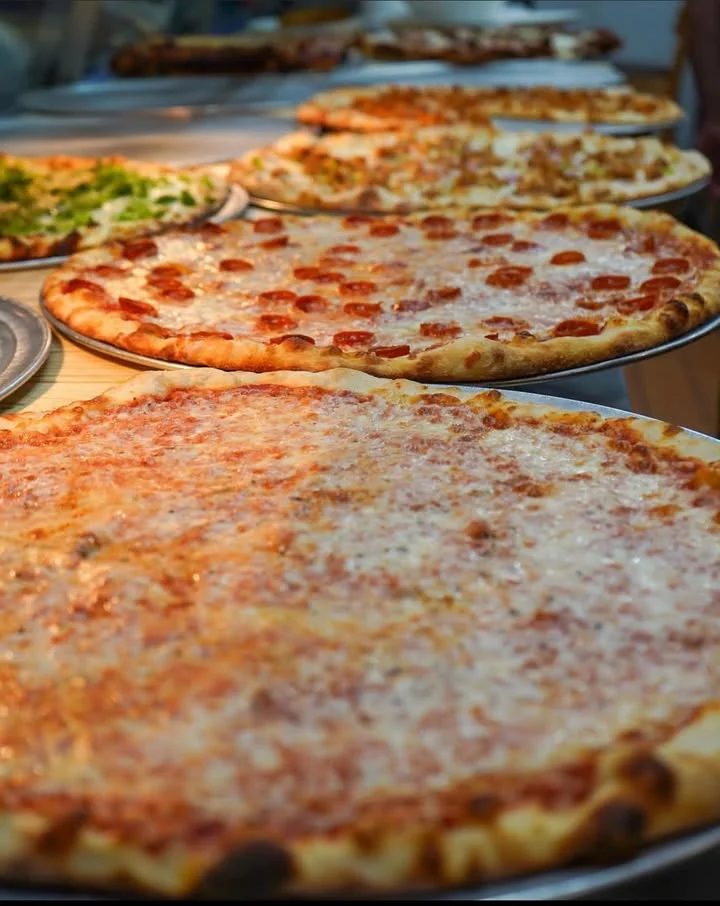 Variety of pizzas including pepperoni and cheese