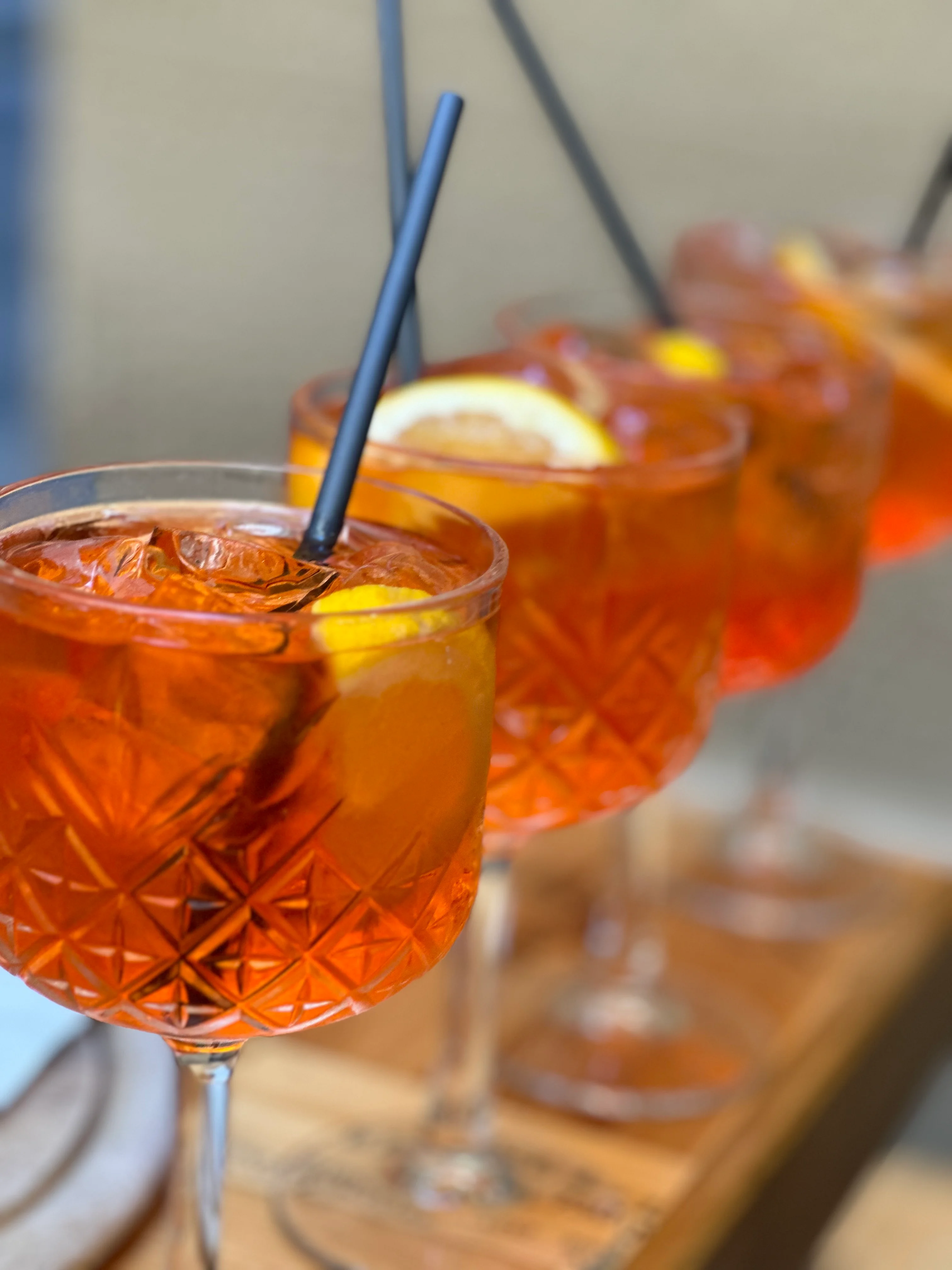 Refreshing Italian spritz cocktails garnished with citrus slices