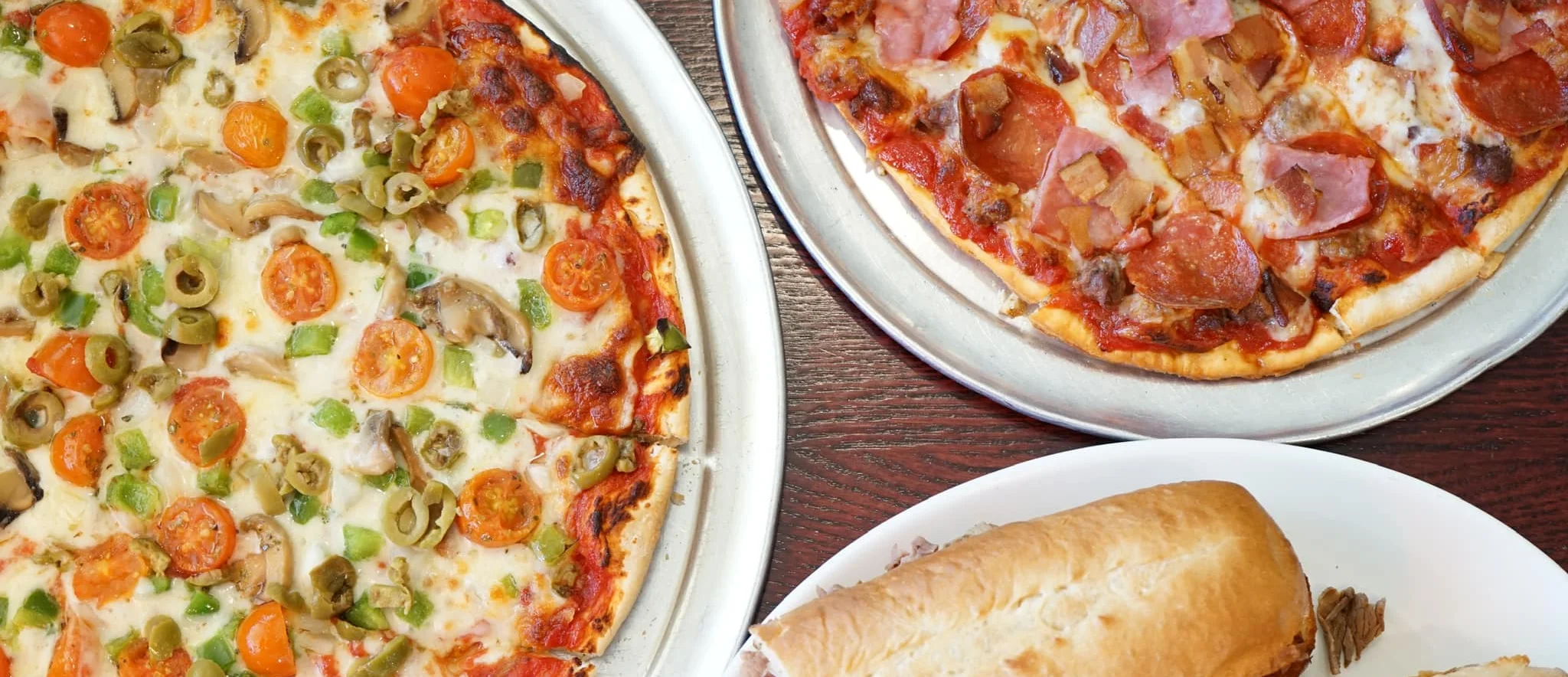 Delicious pepperoni pizza and Italian beef sandwiches