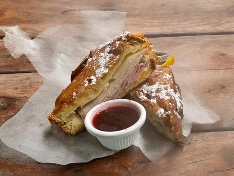Savory ham and cheese croissant with berry sauce