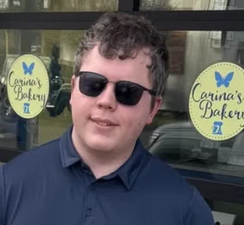 Friendly staff outside Carina's Bakery