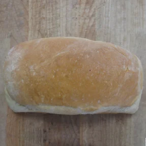 Freshly baked Italian ciabatta bread on a wooden surface