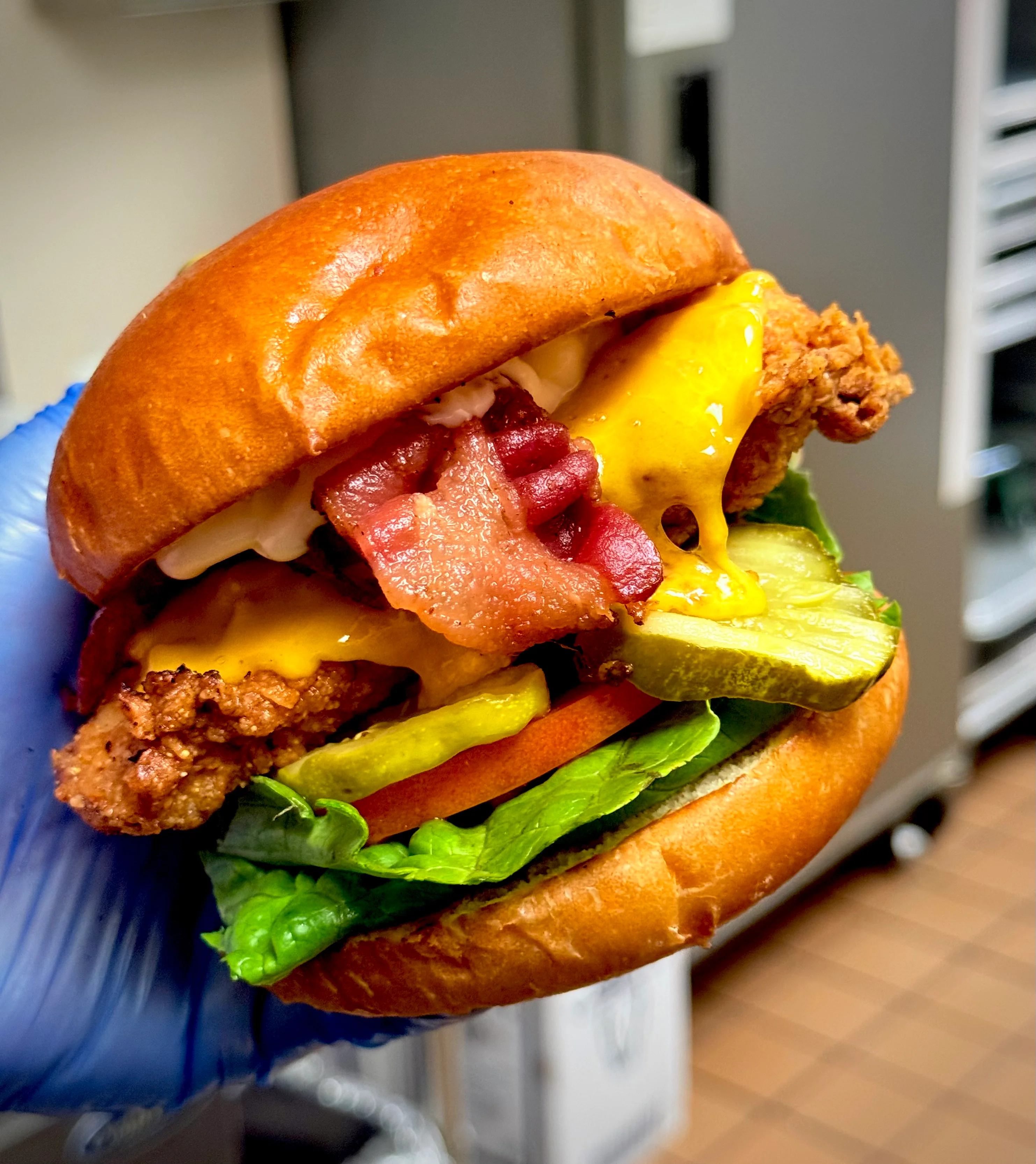 Crispy fried chicken sandwich with bacon and cheese