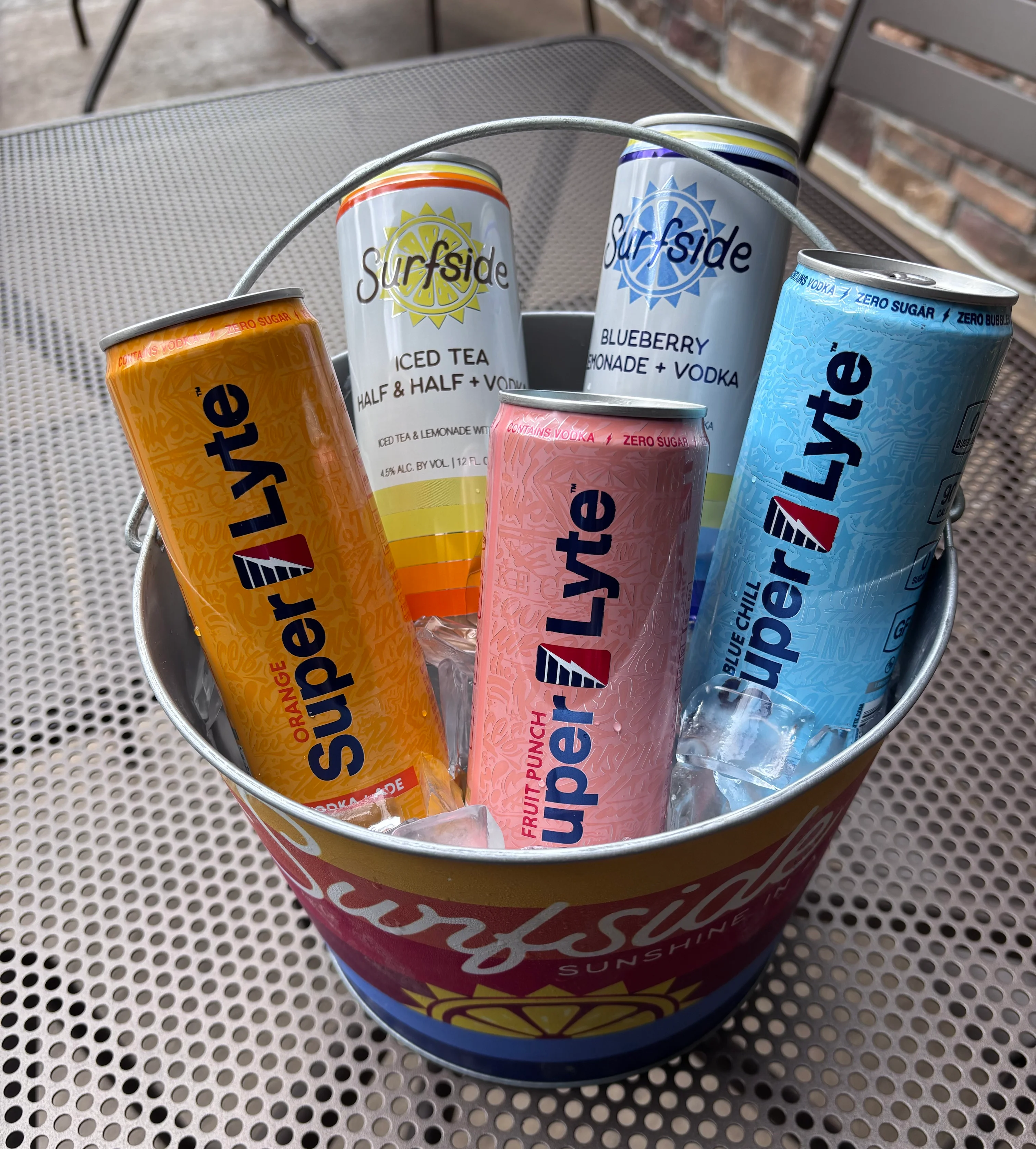 Canned vodka cocktails and iced tea lemonade drinks in an ice-filled bucket