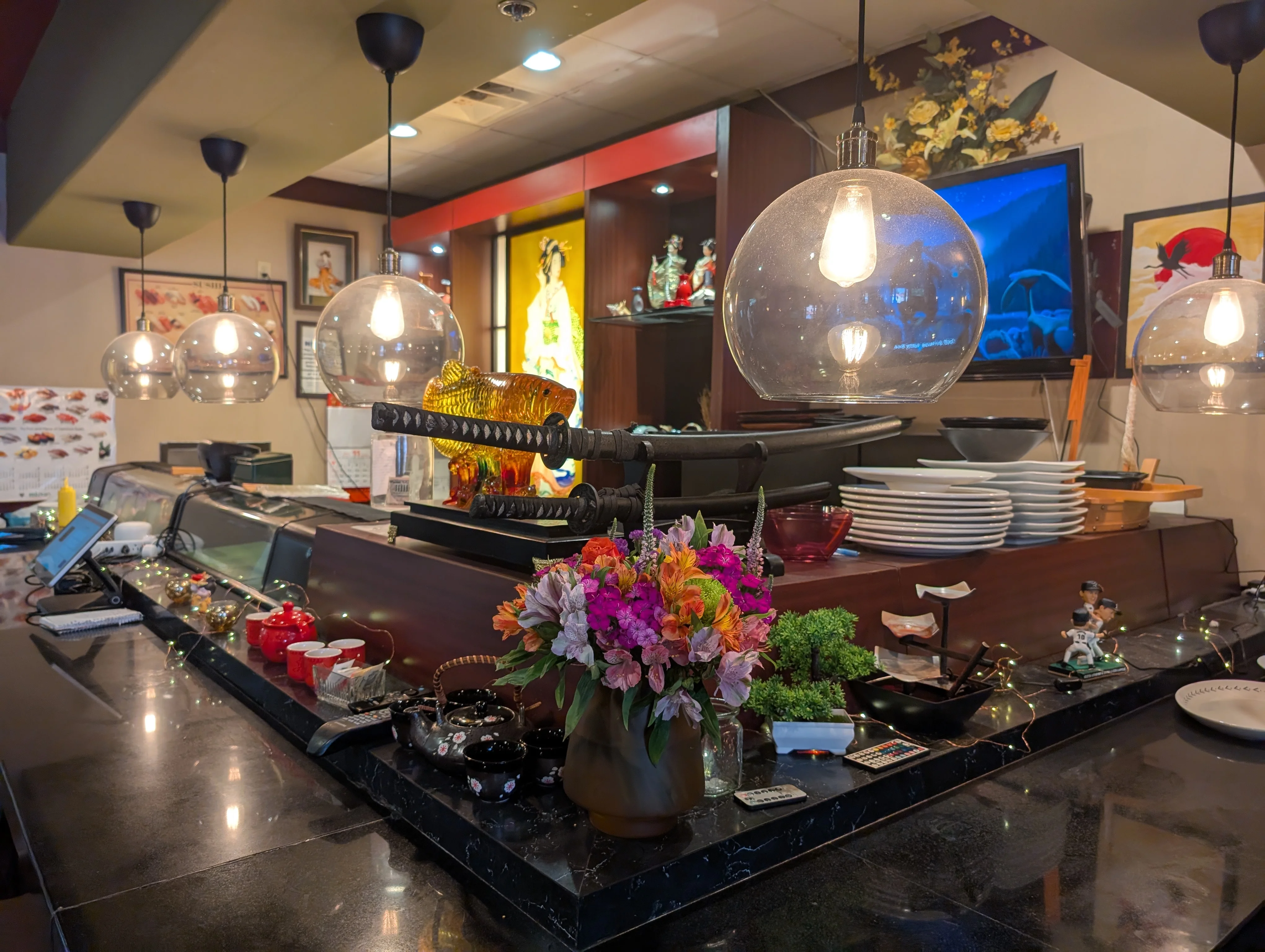 Cozy restaurant counter with decorative elements and warm lighting