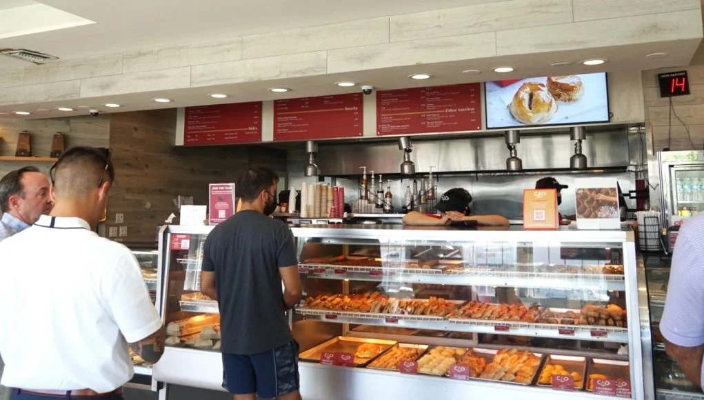 Modern bakery counter with assorted pastries and desserts